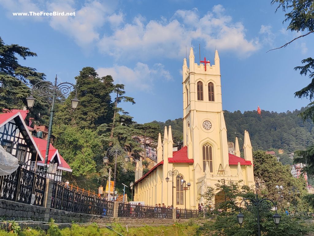 Shimla church with Hanuman statue in background at Jakhu temple